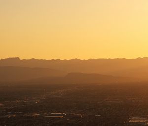 Preview wallpaper mountains, hills, town, sunrise