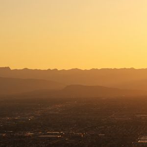 Preview wallpaper mountains, hills, town, sunrise