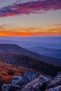 Preview wallpaper mountains, hills, trees, stones, sky, sunset