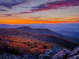 Preview wallpaper mountains, hills, trees, stones, sky, sunset