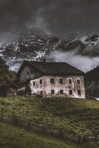 Preview wallpaper mountains, house, old, solitude, grass, fence, fog