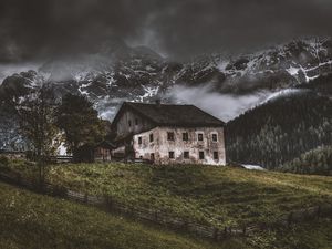 Preview wallpaper mountains, house, old, solitude, grass, fence, fog