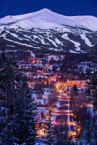 Preview wallpaper mountains, houses, lights, snow, winter, aerial view