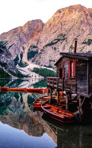 Preview wallpaper mountains, lake, boats, pier, building