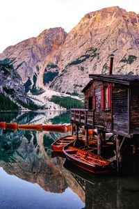 Preview wallpaper mountains, lake, boats, pier, building