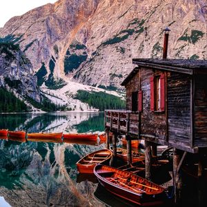 Preview wallpaper mountains, lake, boats, pier, building