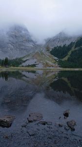 Preview wallpaper mountains, lake, fog, stones, trees