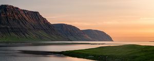 Preview wallpaper mountains, lake, grass, sunset, shore