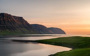 Preview wallpaper mountains, lake, grass, sunset, shore