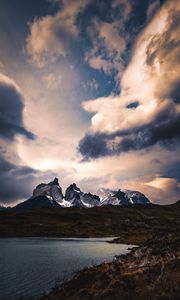 Preview wallpaper mountains, lake, grass, clouds, overcast, twilight