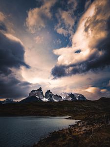 Preview wallpaper mountains, lake, grass, clouds, overcast, twilight