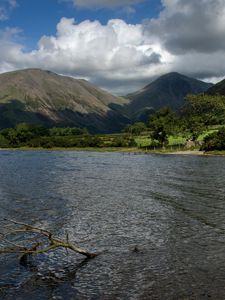 Preview wallpaper mountains, lake, greens, branch, sky, clouds