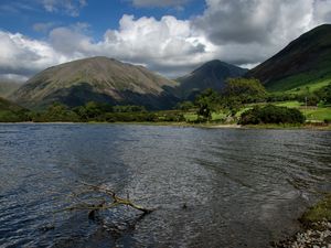 Preview wallpaper mountains, lake, greens, branch, sky, clouds