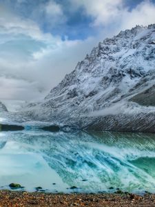 Preview wallpaper mountains, lake, ice, reflection, stones, coast, cold, freshness, clouds