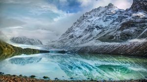 Preview wallpaper mountains, lake, ice, reflection, stones, coast, cold, freshness, clouds