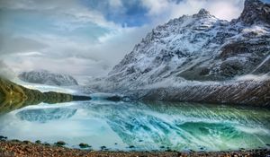 Preview wallpaper mountains, lake, ice, reflection, stones, coast, cold, freshness, clouds