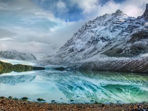 Preview wallpaper mountains, lake, ice, reflection, stones, coast, cold, freshness, clouds