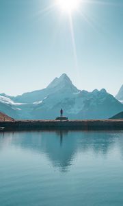 Preview wallpaper mountains, lake, man, silhouette, alone