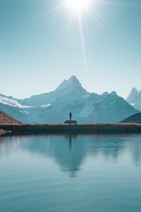 Preview wallpaper mountains, lake, man, silhouette, alone