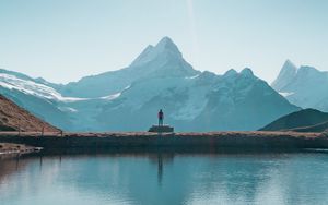 Preview wallpaper mountains, lake, man, silhouette, alone