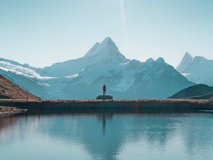 Preview wallpaper mountains, lake, man, silhouette, alone