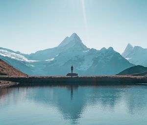 Preview wallpaper mountains, lake, man, silhouette, alone