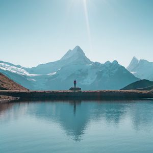 Preview wallpaper mountains, lake, man, silhouette, alone