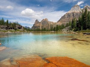 Preview wallpaper mountains, lake, plates, trees, stones