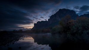 Preview wallpaper mountains, lake, reflection, trees, stones, fog, clouds