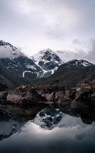 Preview wallpaper mountains, lake, reflection, rocks, clouds, snowy