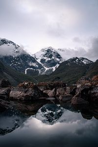 Preview wallpaper mountains, lake, reflection, rocks, clouds, snowy