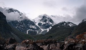 Preview wallpaper mountains, lake, reflection, rocks, clouds, snowy