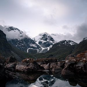 Preview wallpaper mountains, lake, reflection, rocks, clouds, snowy