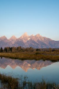 Preview wallpaper mountains, lake, reflection, grass