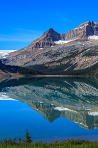 Preview wallpaper mountains, lake, reflection, snow, trees, landscape