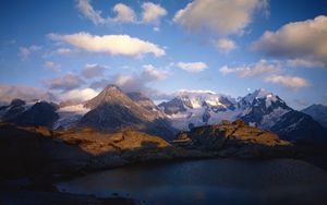 Preview wallpaper mountains, lake, ripples, shade, clouds, snow