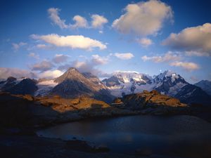 Preview wallpaper mountains, lake, ripples, shade, clouds, snow