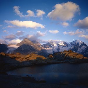 Preview wallpaper mountains, lake, ripples, shade, clouds, snow