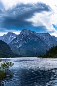 Preview wallpaper mountains, lake, rocks, snow, snowy, branches