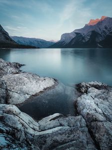 Preview wallpaper mountains, lake, stones, sky, landscape, wildlife