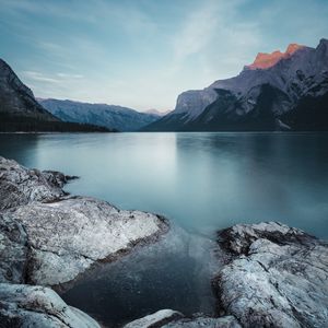 Preview wallpaper mountains, lake, stones, sky, landscape, wildlife