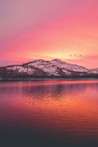 Preview wallpaper mountains, lake, sunset, horizon, birds