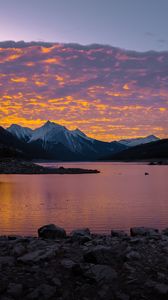 Preview wallpaper mountains, lake, sunset, stones, clouds
