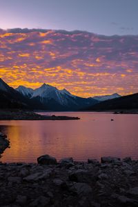 Preview wallpaper mountains, lake, sunset, stones, clouds