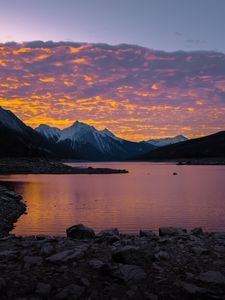 Preview wallpaper mountains, lake, sunset, stones, clouds