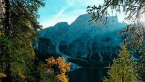 Preview wallpaper mountains, lake, trees, branches, sky, clouds