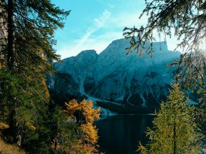Preview wallpaper mountains, lake, trees, branches, sky, clouds