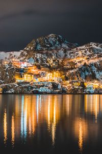 Preview wallpaper mountains, lake, village, night, light, snow