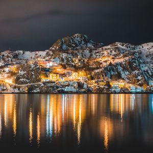 Preview wallpaper mountains, lake, village, night, light, snow