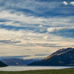 Preview wallpaper mountains, lake, water, grass, landscape, travel